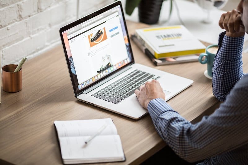 women working on MacBook ATS Connection