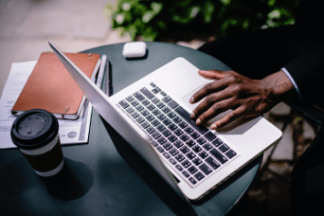 Man on a Macbook ATS Connection