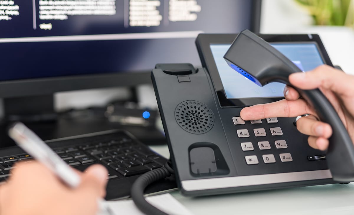 Man using a VoIP phone