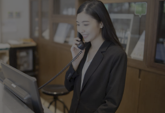 Lady on phone at hotel reception