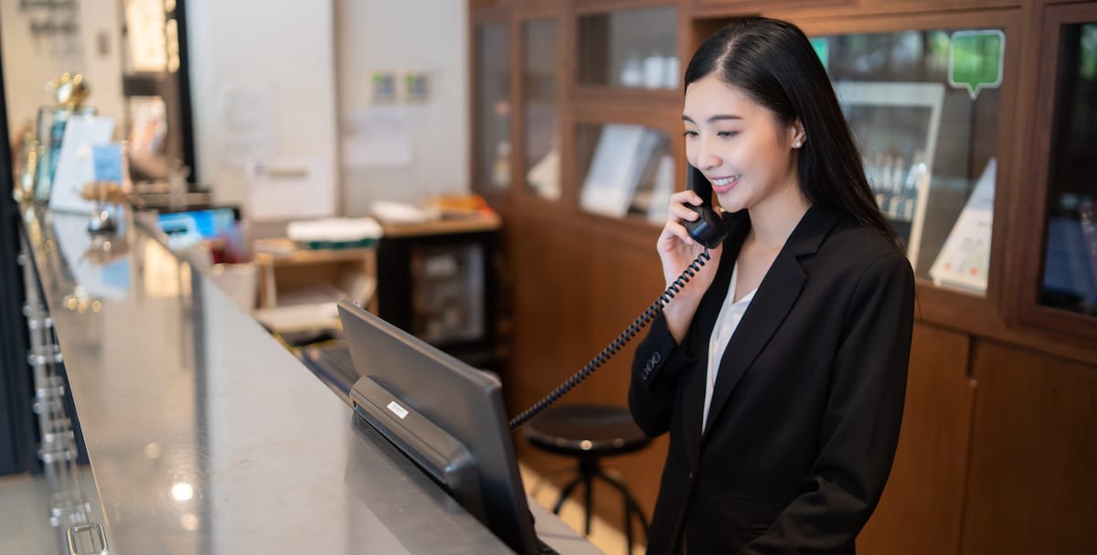receptionist on VoIP phone